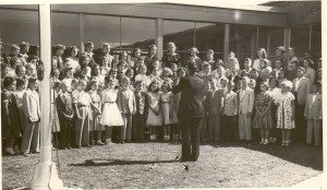 Hershey Estates vice president James E. Bobb leads a group of children at Hershey Elementary School