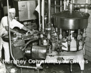 Hershey Creamery employee, Al Tesno, bottles milk, ca. 1951-1959