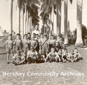 Milton Hershey established an orphan school near Central Rosario. He operated it for ten years before donating it to a local orphanage. Students and their teacher at Colonia Infantil Hershey, 1957