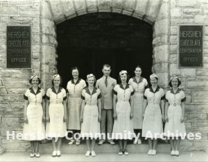 Hershey Chocolate Factory visitors department; Tour Director Lloyd Shoap and hostesses, ca. 1936-1940