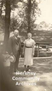 Milton Hershey poses with a kitchen employee at a Hershey Industrial School picnic held at Hershey Park, 1938