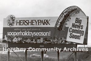 Billboard advertising a new ride coming to Hersheypark for the 1977 summer season.