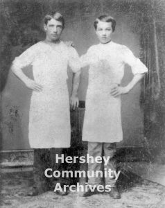 Milton Hershey (right) poses with another worker at Royer's Ice Cream Parlor and Garden in Lancaster, PA, ca. 1873