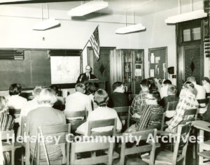 The Junior College offered residents and Hershey employees two years of free college education. Professor William Schmehl lectures to a class, ca. 1950-1959