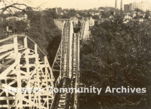 Wild Cat roller coaster looking south east from the top of the first hill, factory in background, ca. 1923-1945