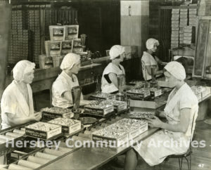 Workers hand-boxing KISSES chocolates in the Hershey Chocolate Factory wrapping department, ca. 1930-1935