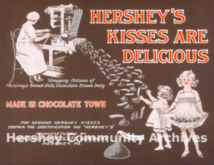 Advertisement showcasing the new “identification tag,” more often referred to as the paper “plume” for the Hershey’s KISSES wrapper, 1921