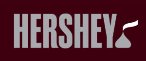 The Hershey Company's current corporate logo with the iconic KISSES chocolate and plume